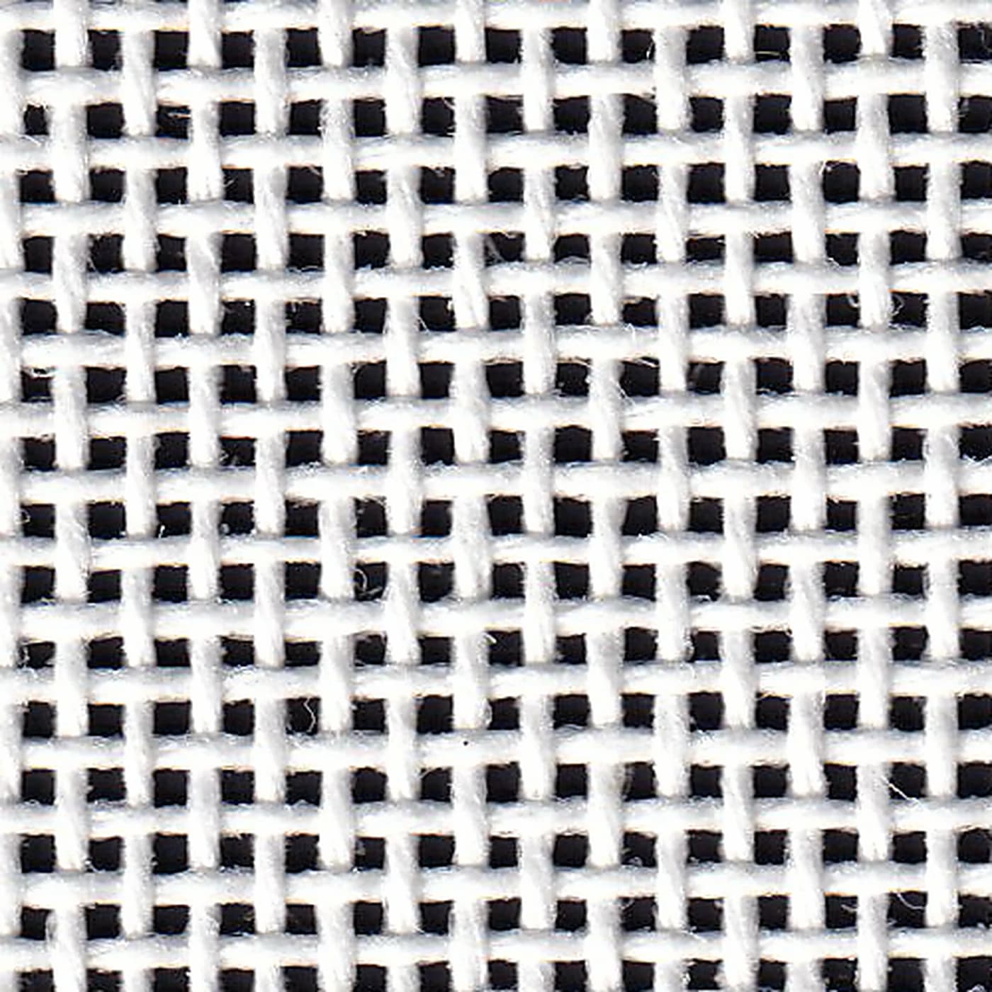 Macro view of a Happy Stitch 18-mesh Mono needlepoint canvas — the woven thread grid HappyGrid measures before every print.